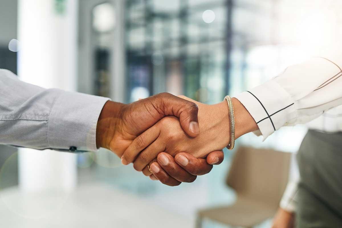 two people shaking hands.