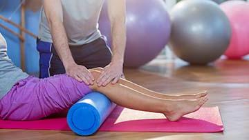 Persons legs on a roller.