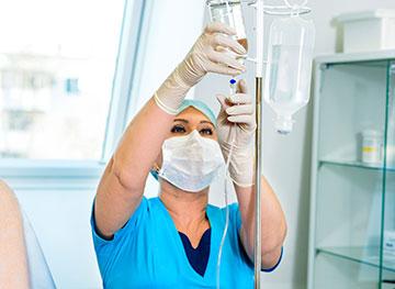 Nurse connecting the IV in the Pre-Health Science Program at San Juan College